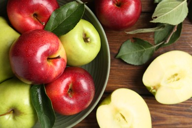 Photo of Fresh red and green apples on wooden table, flat lay