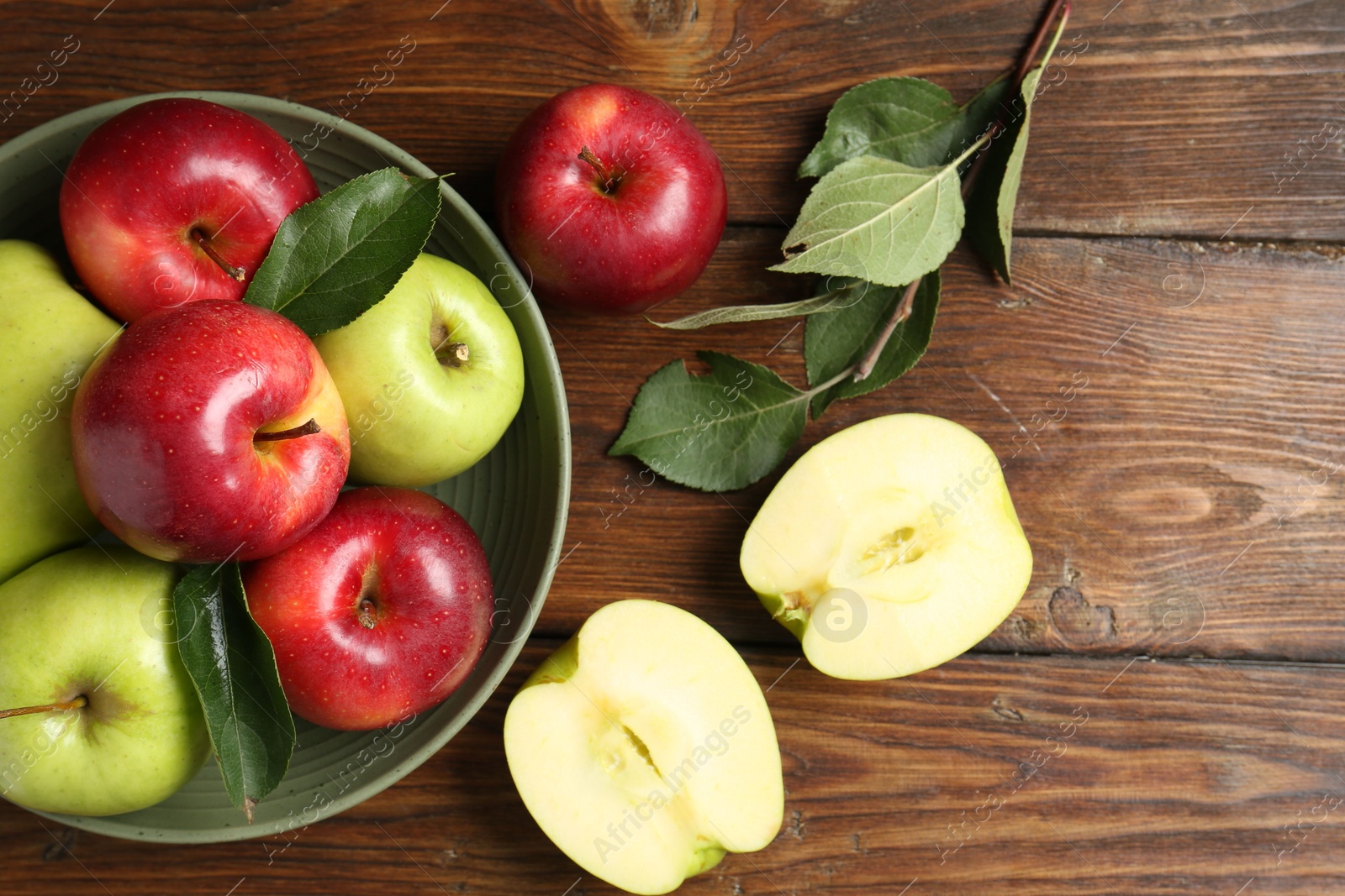 Photo of Fresh red and green apples on wooden table, flat lay