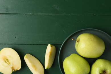 Photo of Fresh ripe apples on green wooden table, flat lay. Space for text