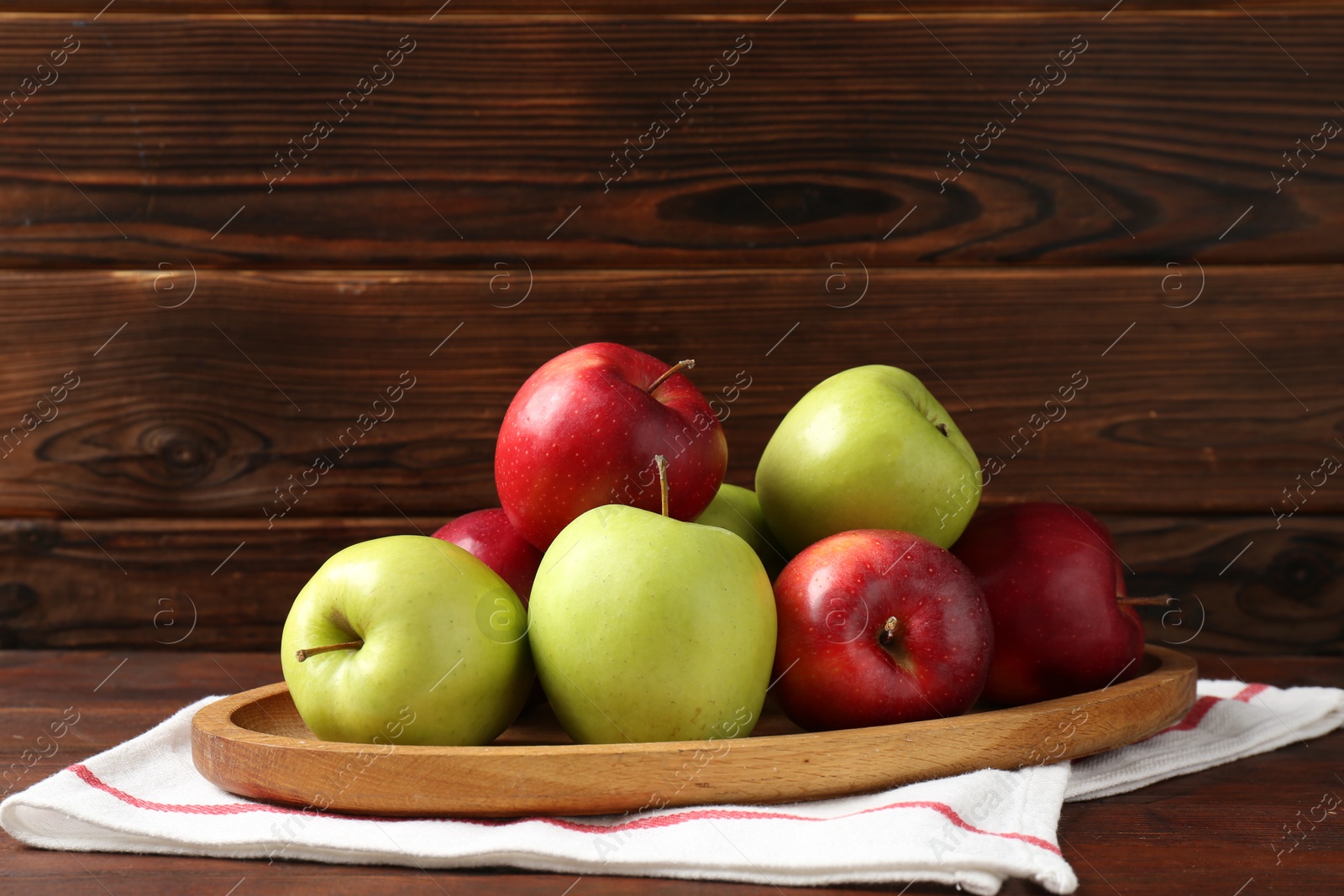 Fresh red and green apples on wooden table Photo of Fresh red and green apples on wooden table