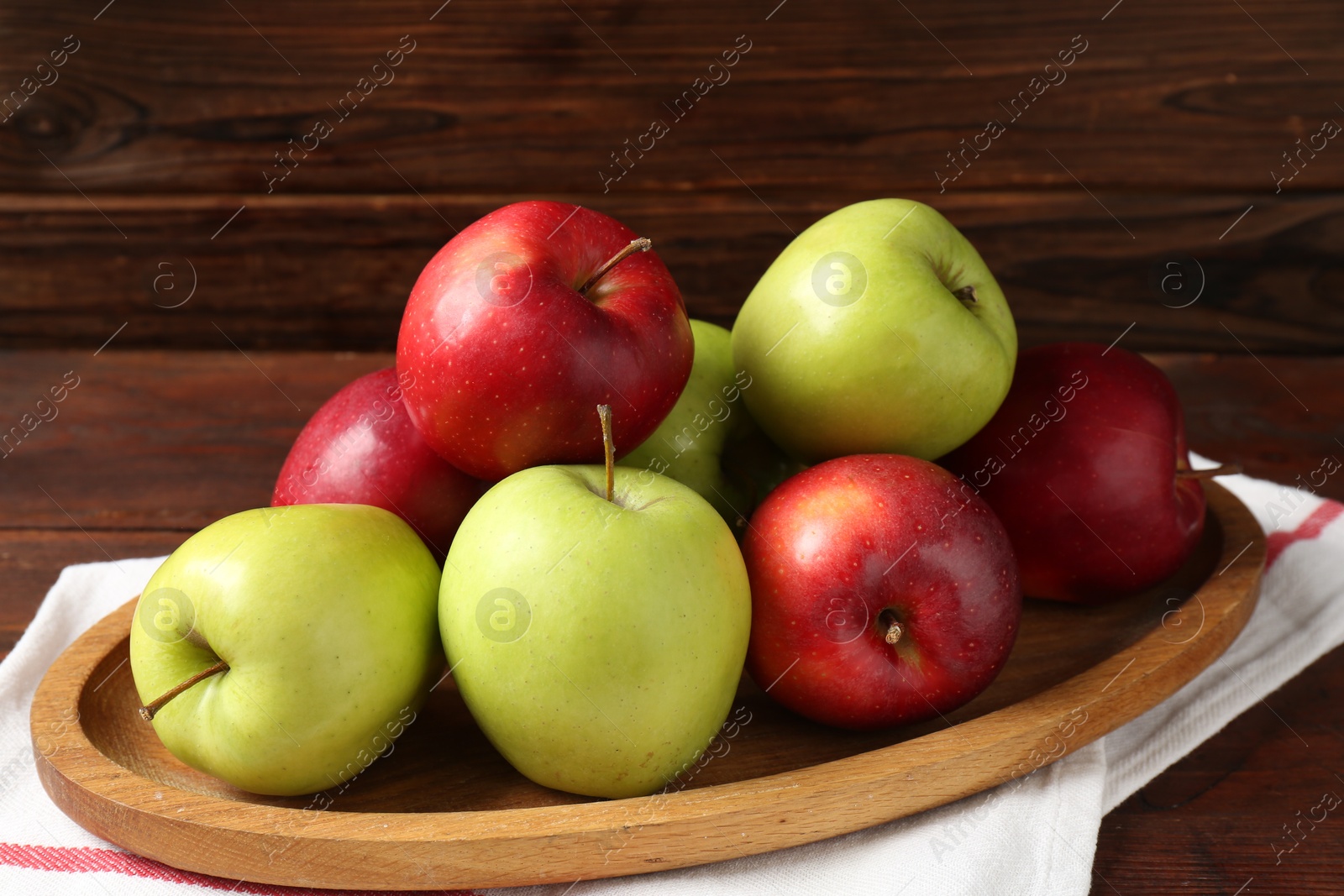 Fresh red and green apples on wooden table Photo of Fresh red and green apples on wooden table