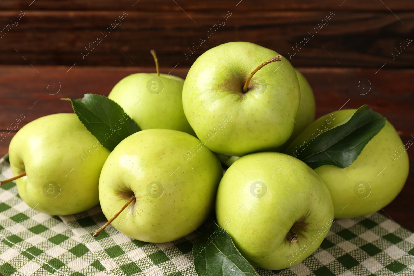 Photo of Many fresh green apples on wooden table