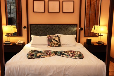 Comfortable large bed in stylish hotel room