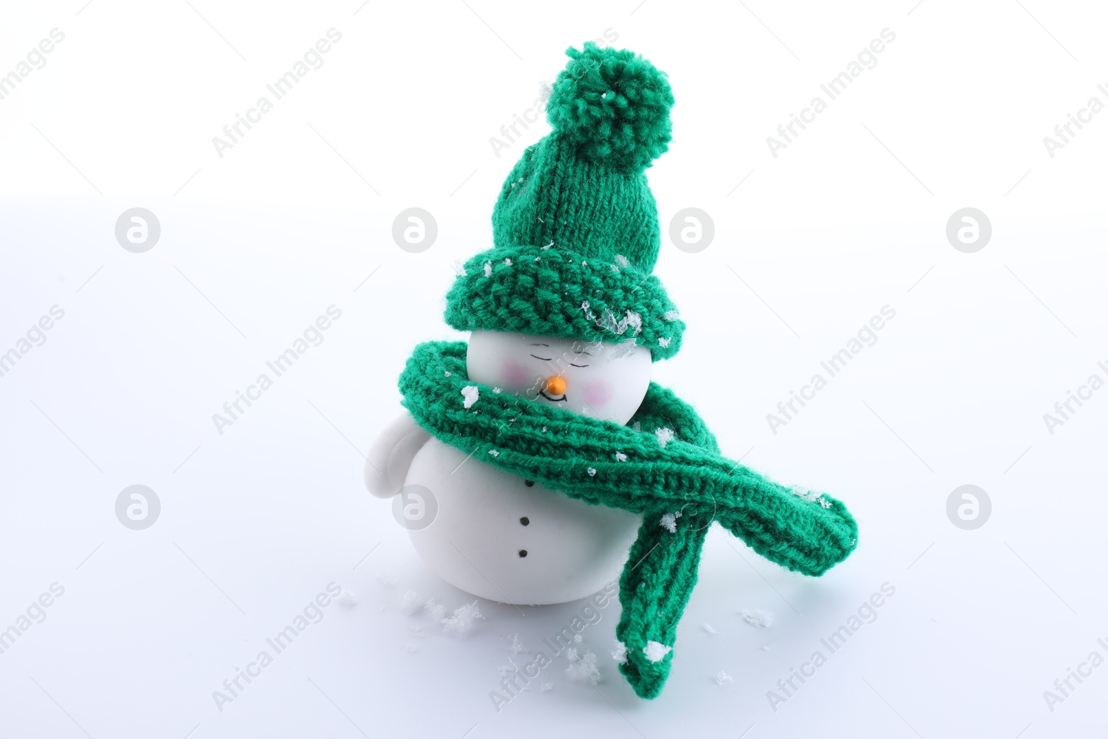 Photo of Cute decorative snowman in hat isolated on white