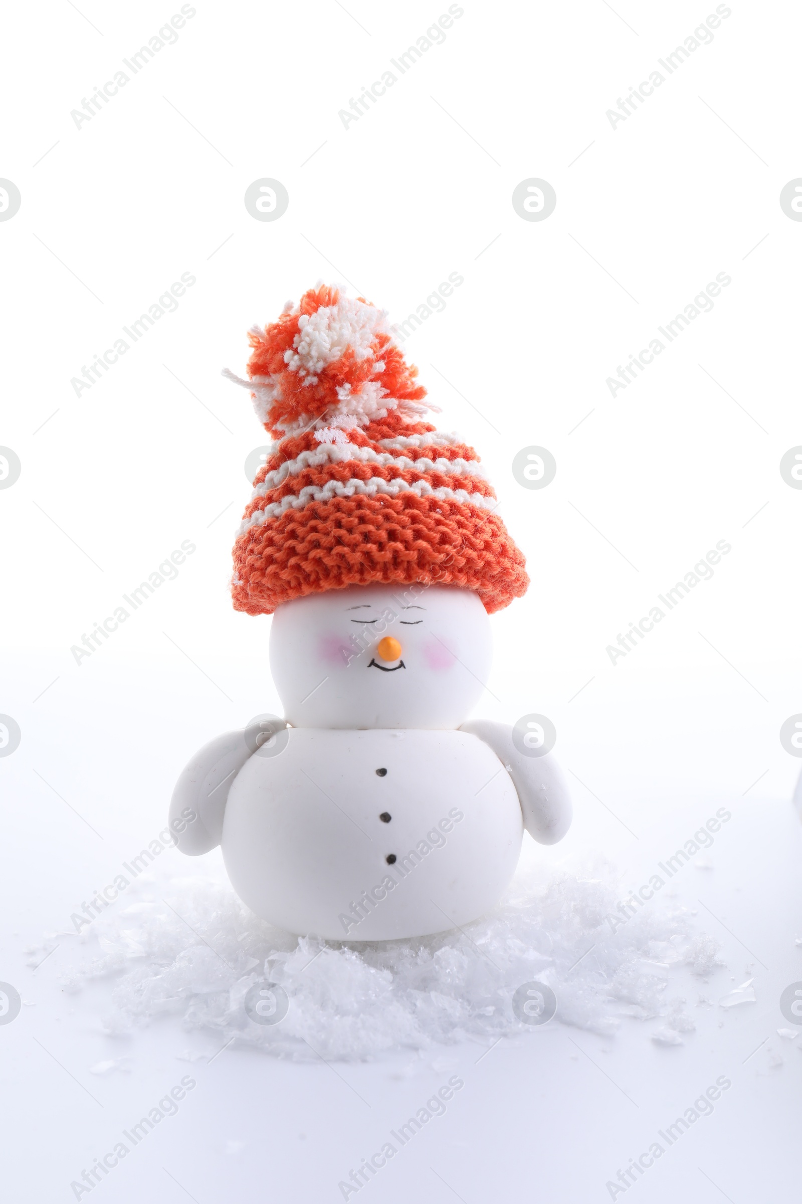 Photo of Cute decorative snowman and artificial snow isolated on white