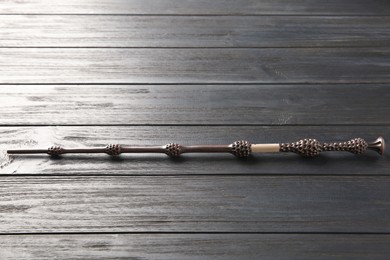 Photo of One old magic wand on wooden table