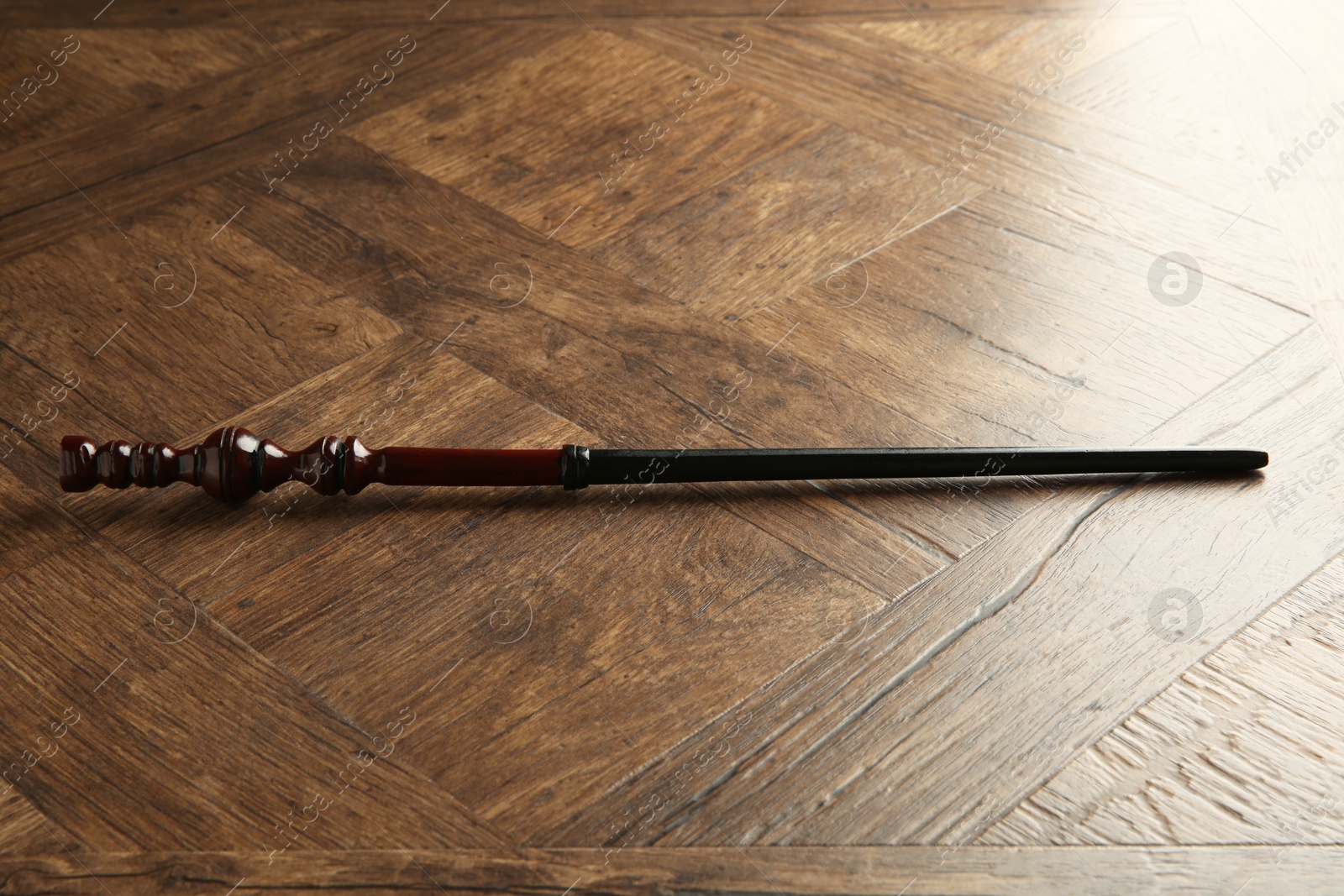 Photo of One old magic wand on wooden table