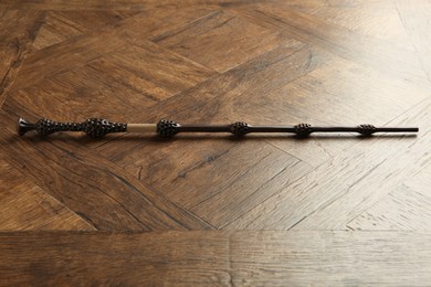 Photo of One old magic wand on wooden table