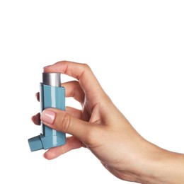 Woman holding asthma inhaler on white background, closeup