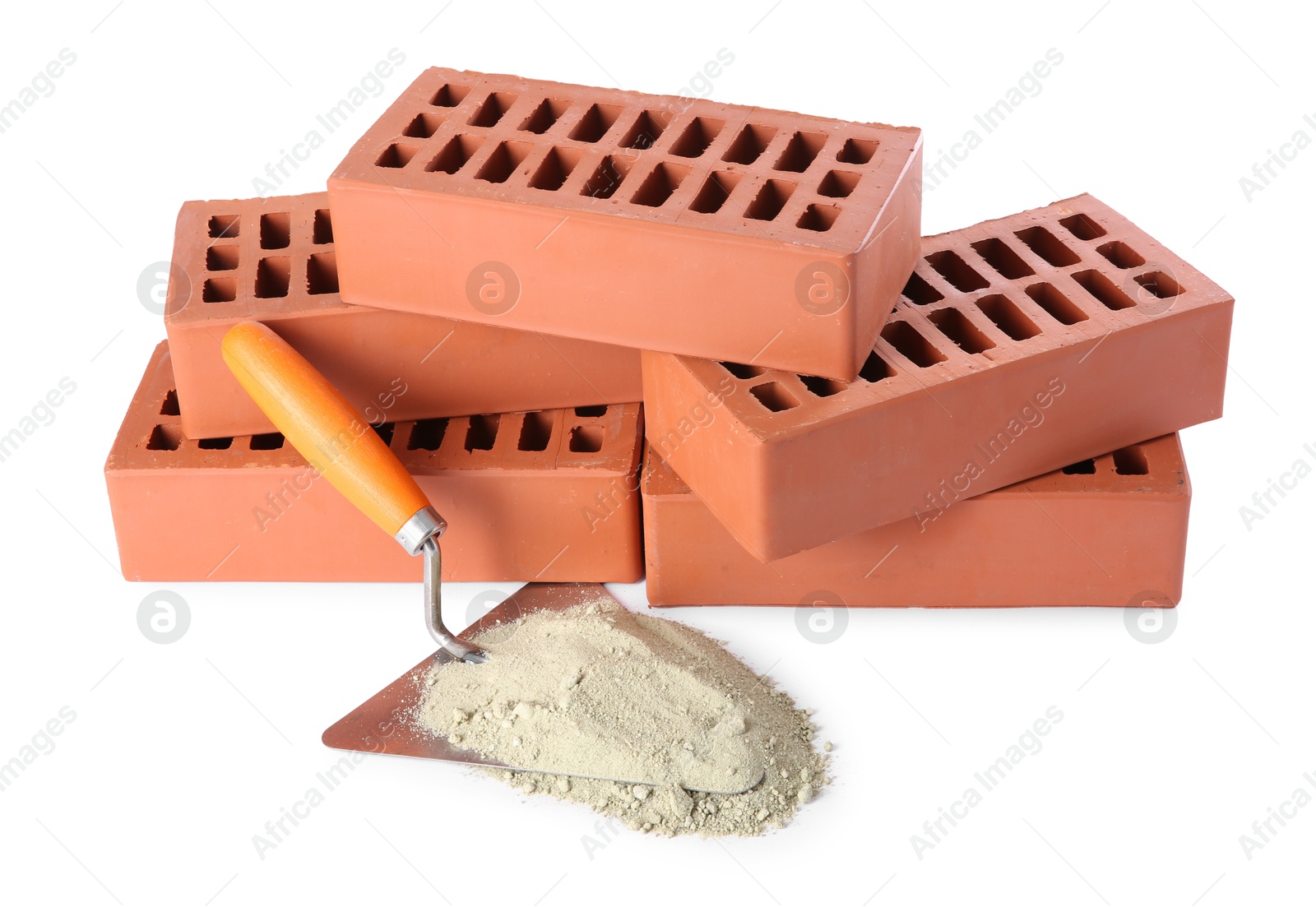 Photo of Trowel, cement powder and red bricks isolated on white. Building materials