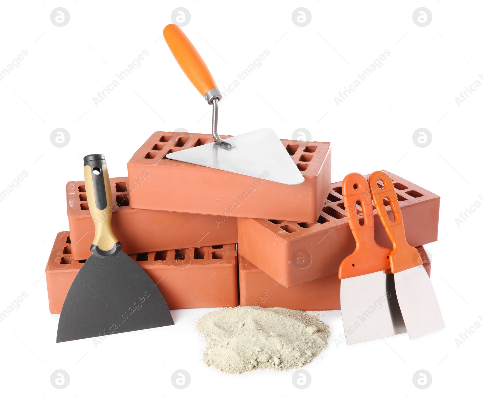 Photo of Trowel, putty knives, cement powder and red bricks isolated on white. Building materials and construction tools