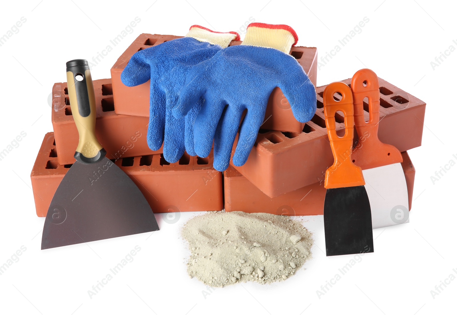 Photo of Putty knives, cement powder, gloves and red bricks isolated on white. Building materials and construction tools