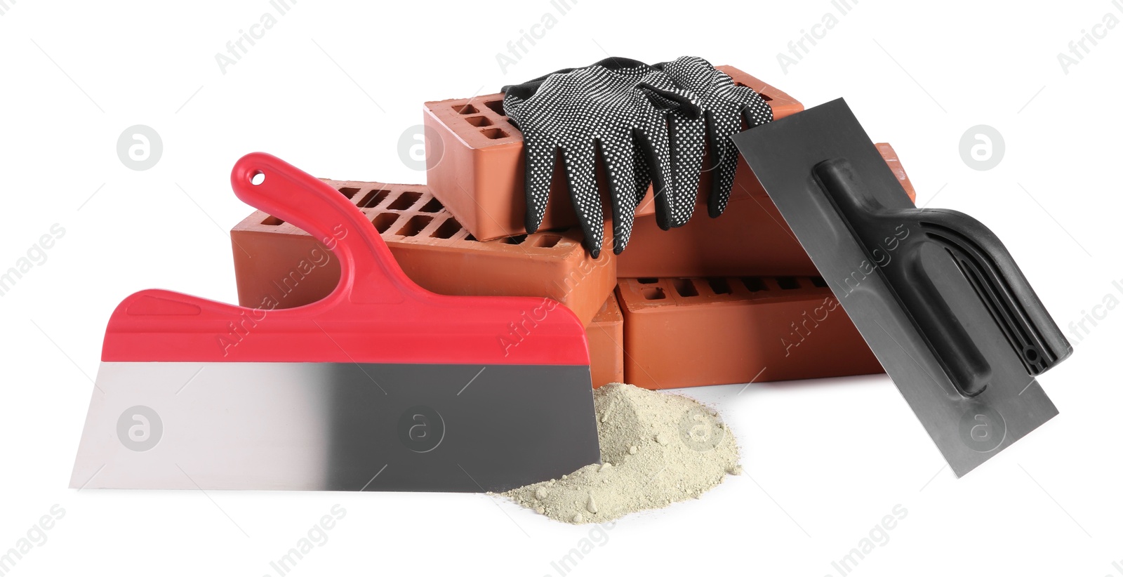 Photo of Putty knives, cement powder, gloves and red bricks isolated on white. Building materials and construction tools