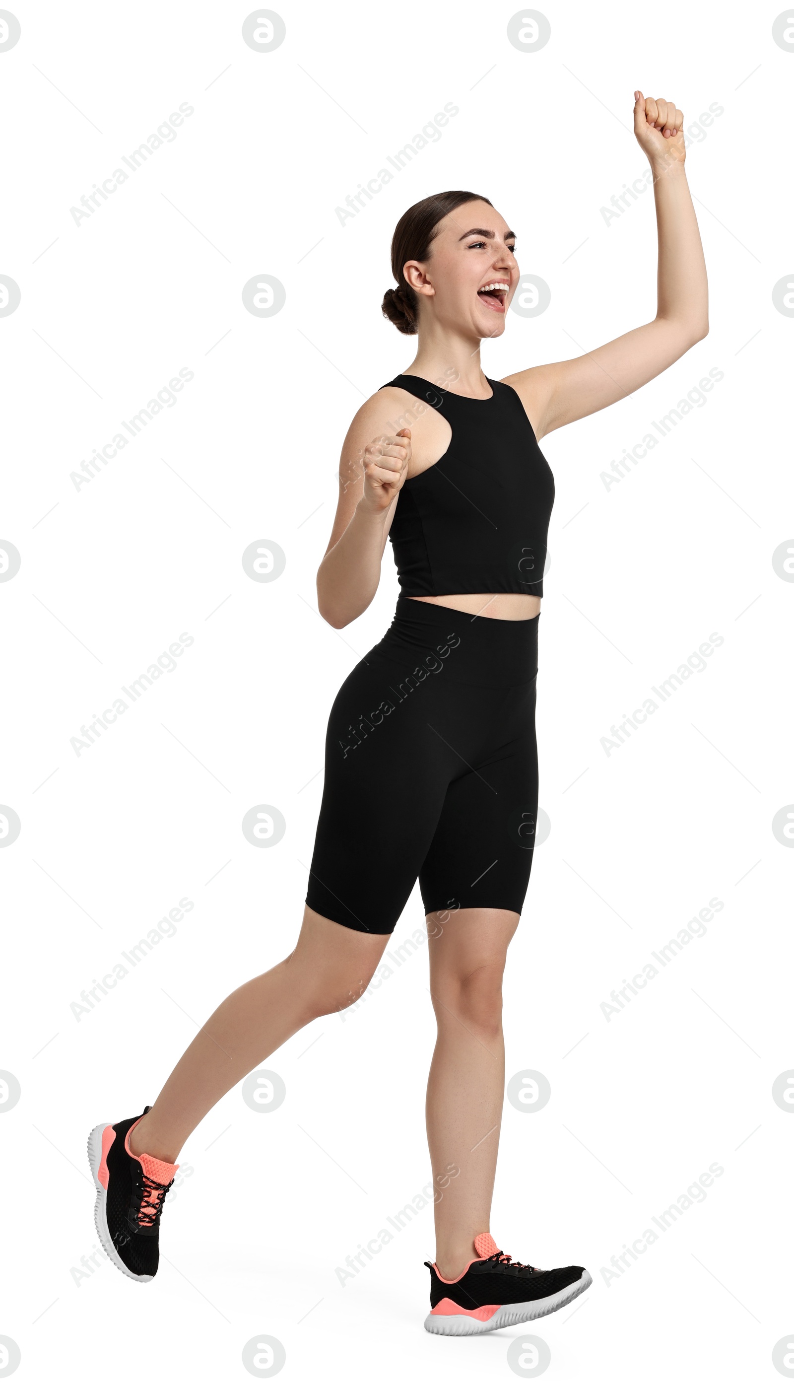 Photo of Beautiful woman in sportswear running on white background