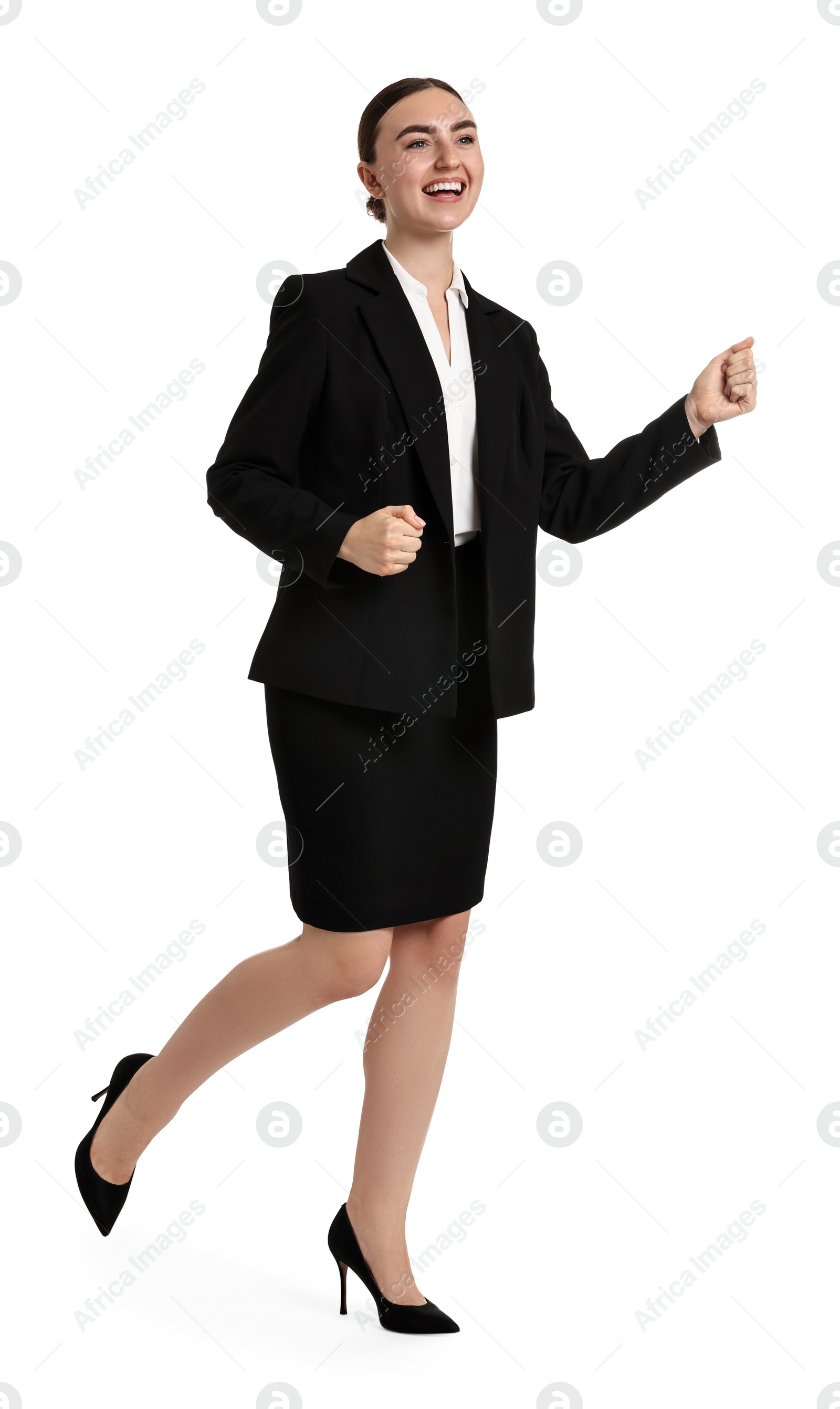 Photo of Young businesswoman in suit running on white background