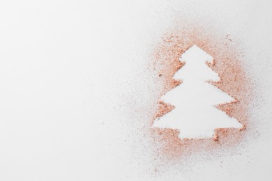 Photo of Christmas tree made of powder on white background, top view. Space for text