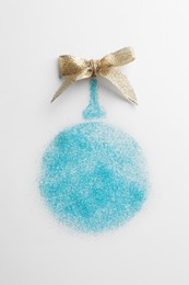 Christmas ball made of light blue glitter with bow on white background, top view