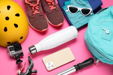 Photo of Bicycle accessories and equipment on pink background