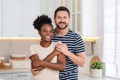 Photo of International relationships. Portrait of lovely couple in kitchen