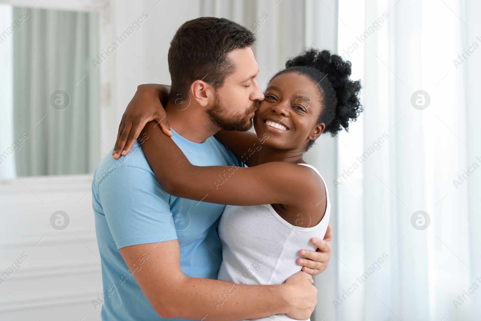 Photo of International relationships. Portrait of lovely couple at home