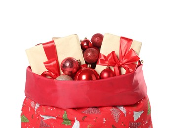 Photo of Santa Claus bag with gift boxes and Christmas balls isolated on white