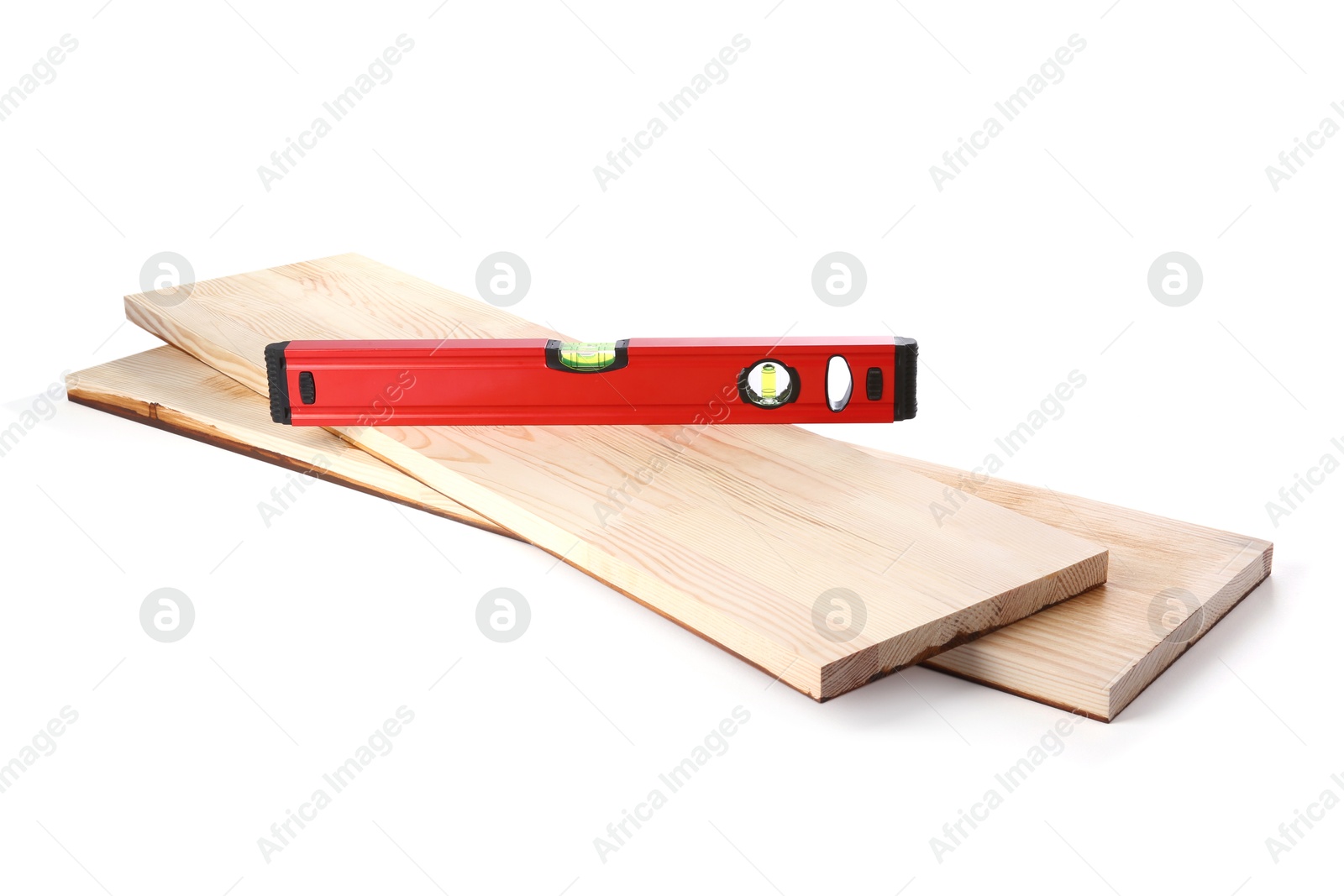 Photo of Wooden planks and building level isolated on white. Construction tools