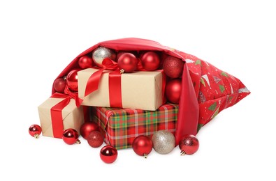 Photo of Santa Claus bag with gift boxes and Christmas balls isolated on white