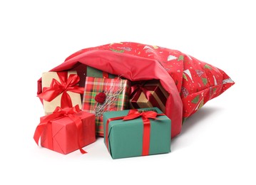 Photo of Santa Claus bag with gift boxes isolated on white