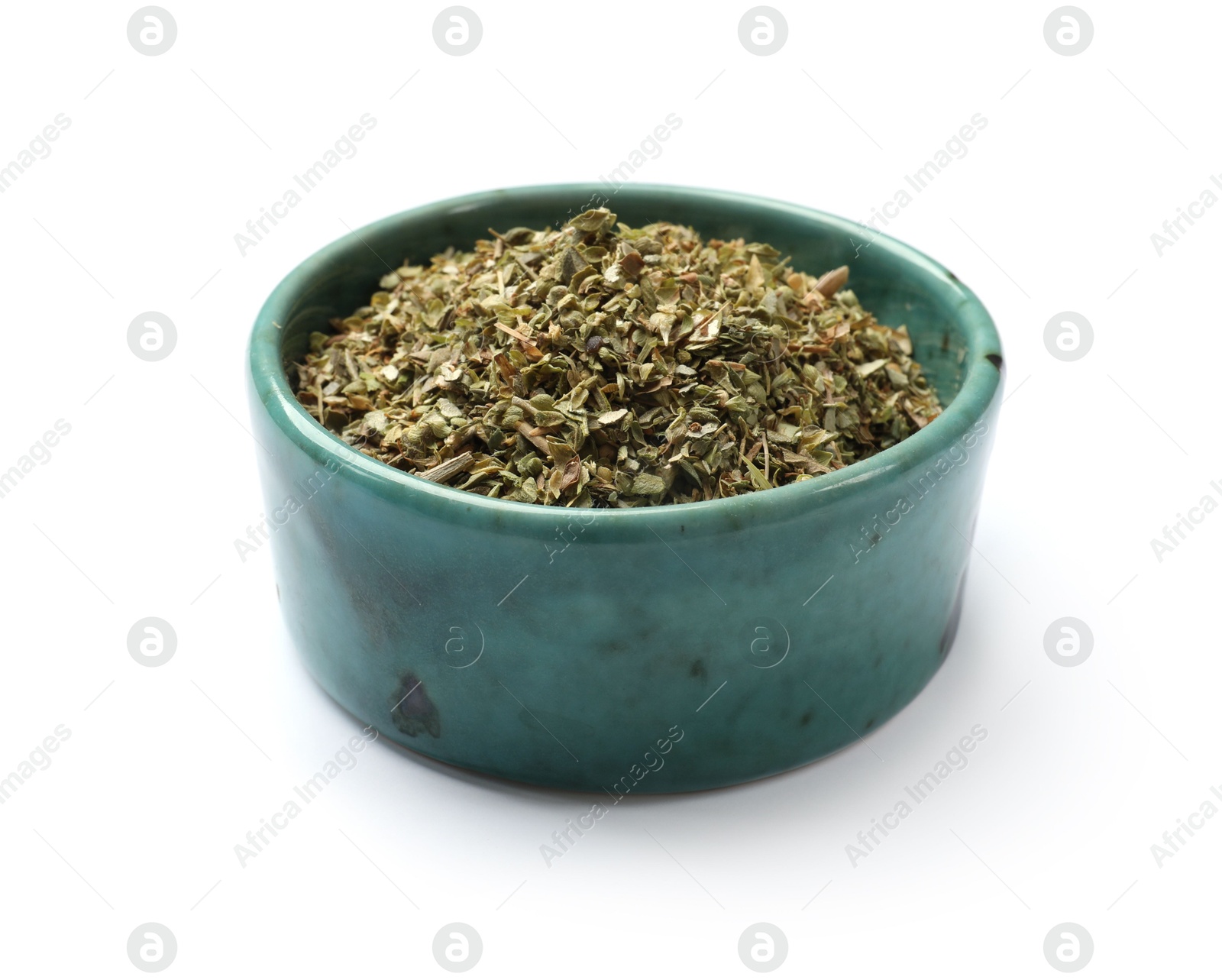 Photo of Dried oregano in bowl isolated on white