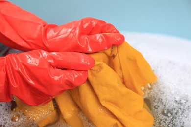 Photo of Woman washing garment in basin, closeup. Laundry