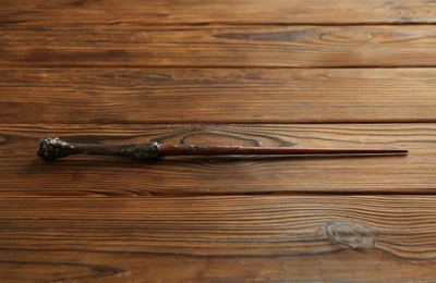 One old magic wand on wooden table