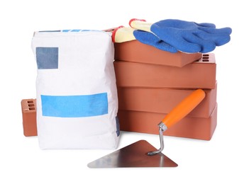 Cement powder in bag, trowel, gloves and red bricks isolated on white. Building materials and construction tools