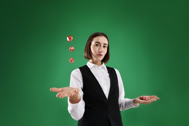 Photo of Croupier with dice and casino chips on green background