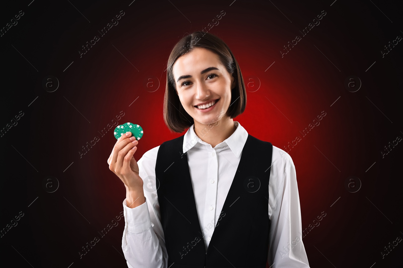 Photo of Croupier with casino chips on dark red background