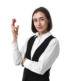 Professional croupier with casino chip on white background