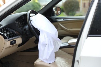 Opened airbag in automobile. Car safety equipment