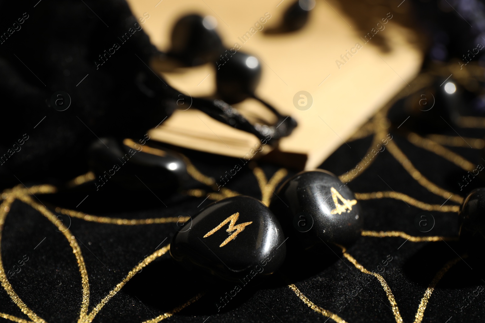 Photo of Black runes on divination mat, closeup view