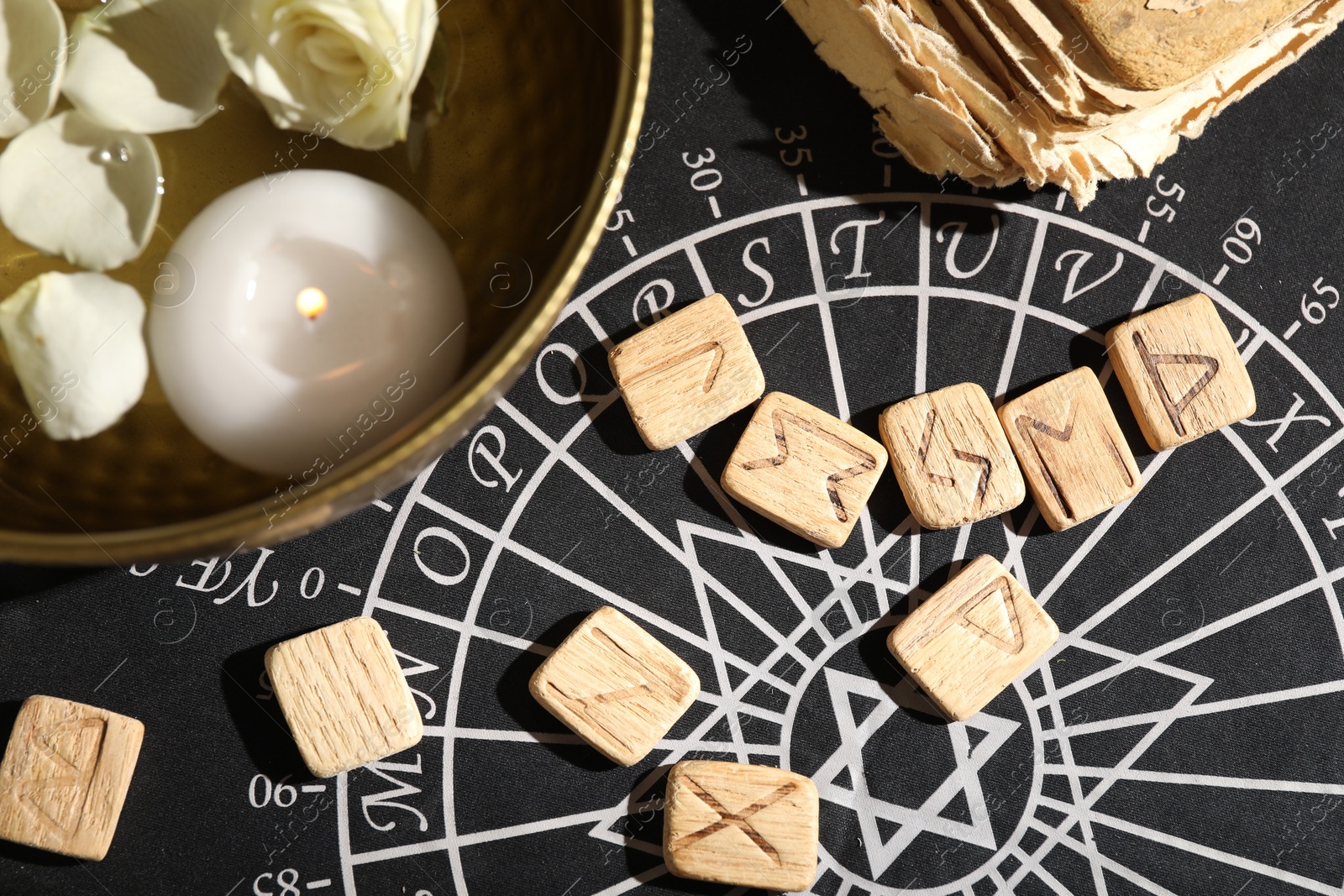 Photo of Flat lay composition with wooden runes on divination mat