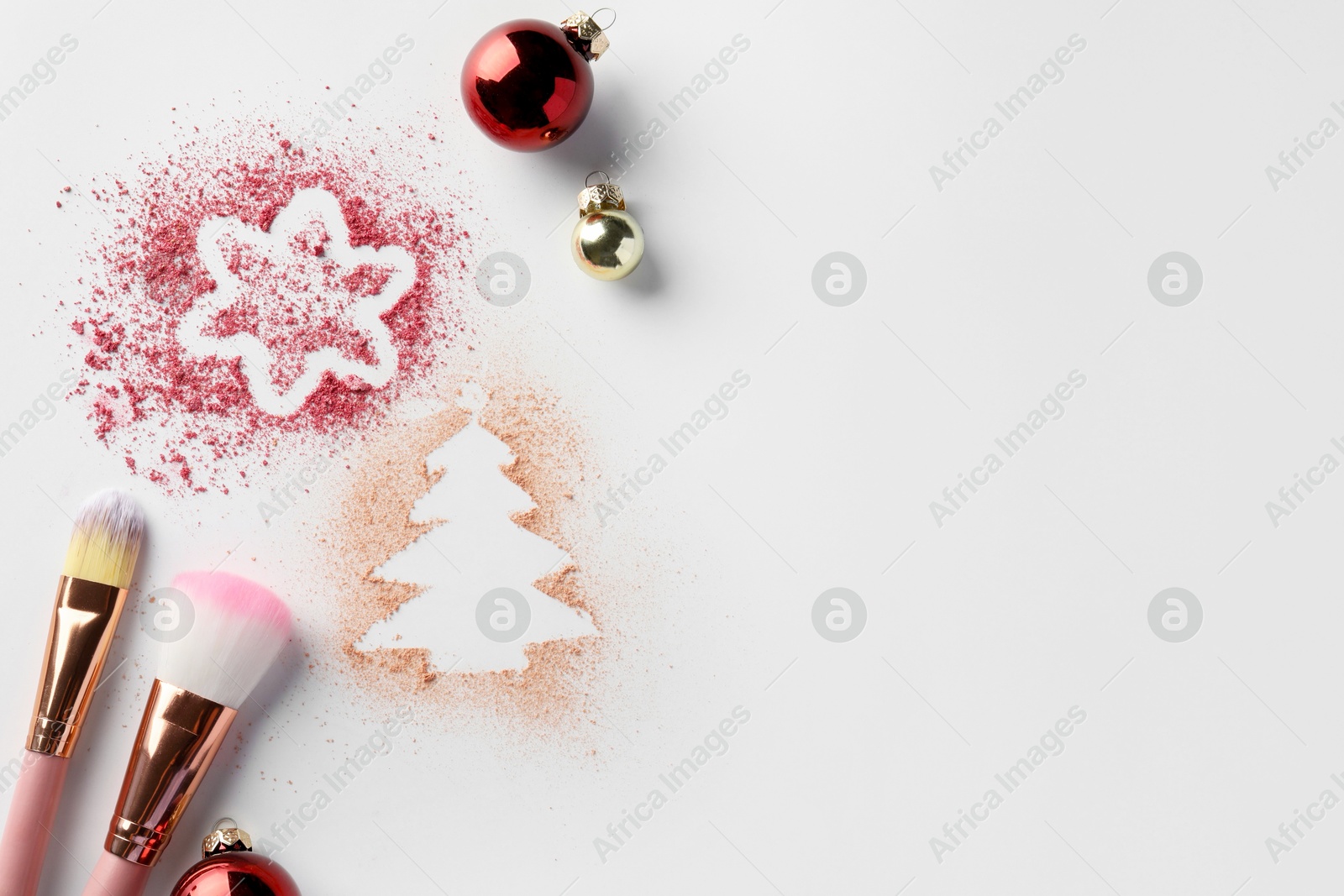 Photo of Christmas decorations made of powder and blush, balls and makeup brushes on white background, flat lay. Space for text