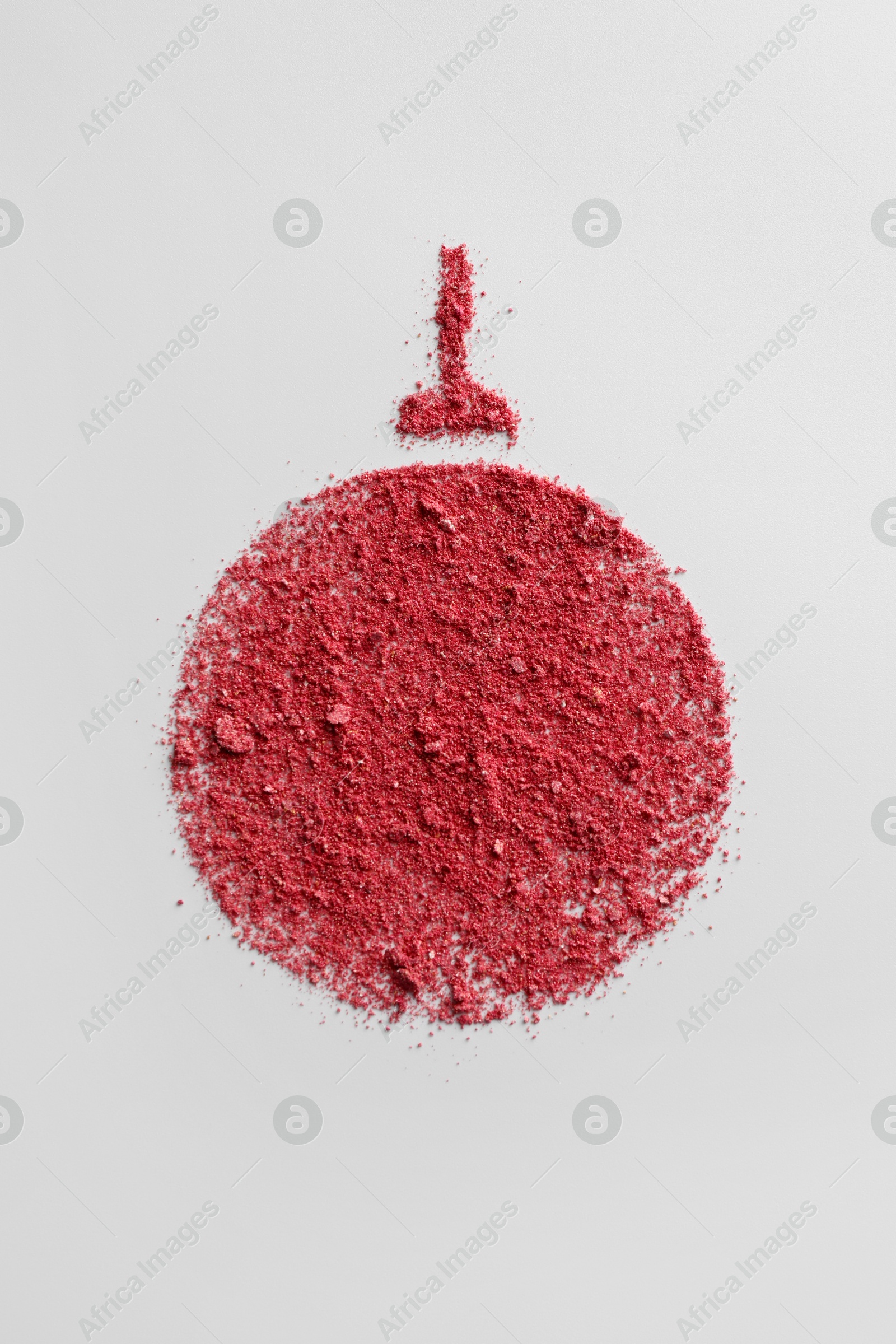 Photo of Christmas ball made of blush on white background, top view