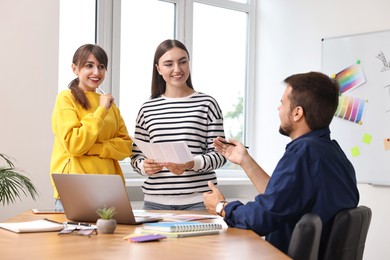 Group of designers working together in office