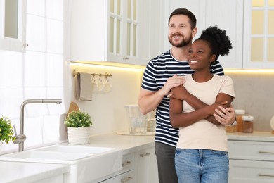 Photo of International relationships. Portrait of lovely couple in kitchen