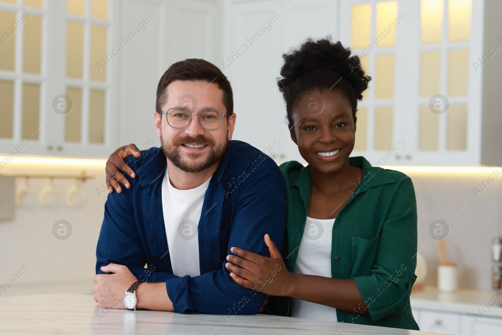 Photo of International relationships. Portrait of lovely couple in kitchen