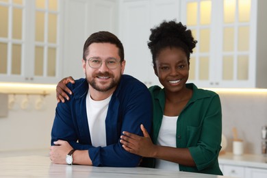 International relationships. Portrait of lovely couple in kitchen