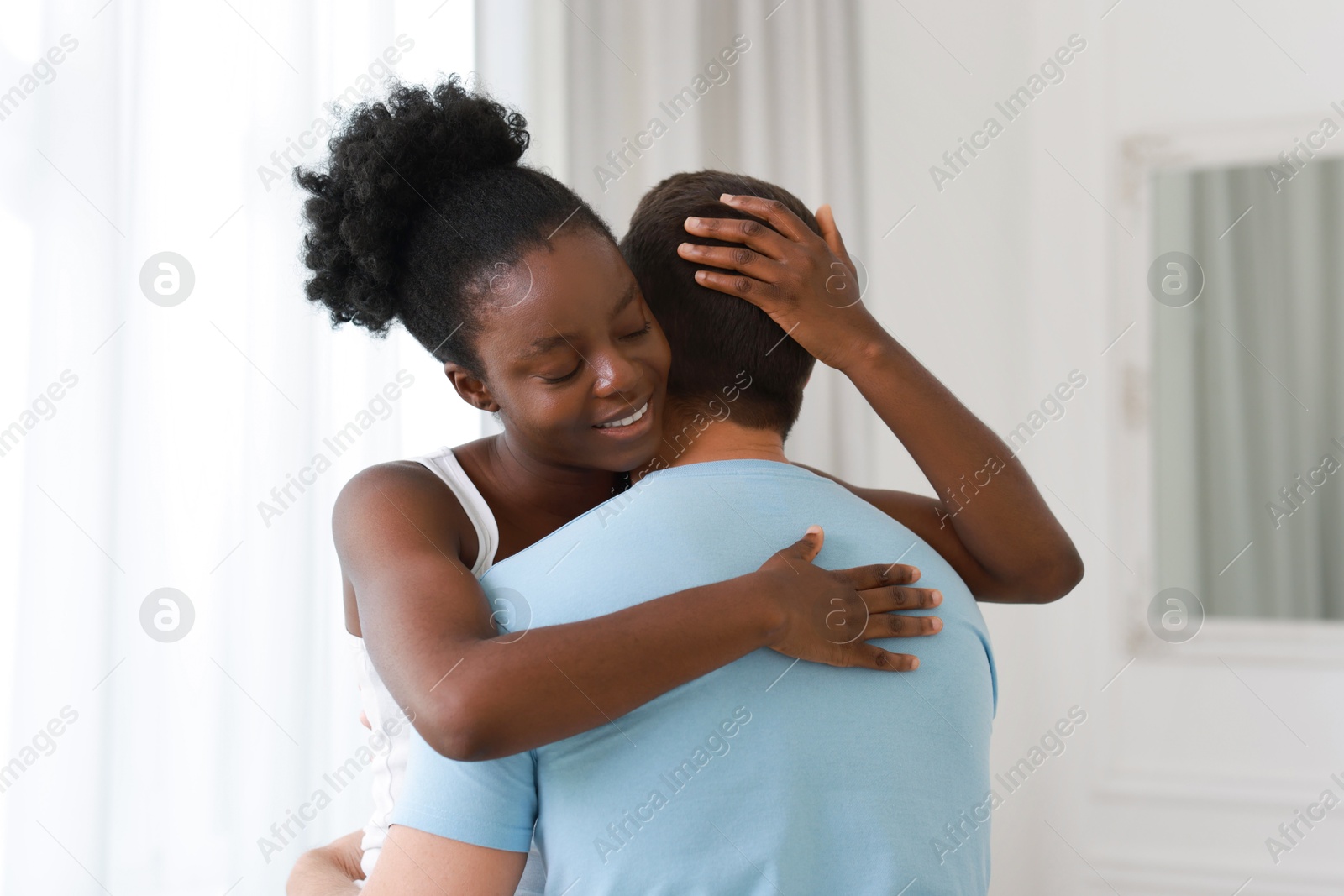 Photo of International relationships. Portrait of lovely couple at home