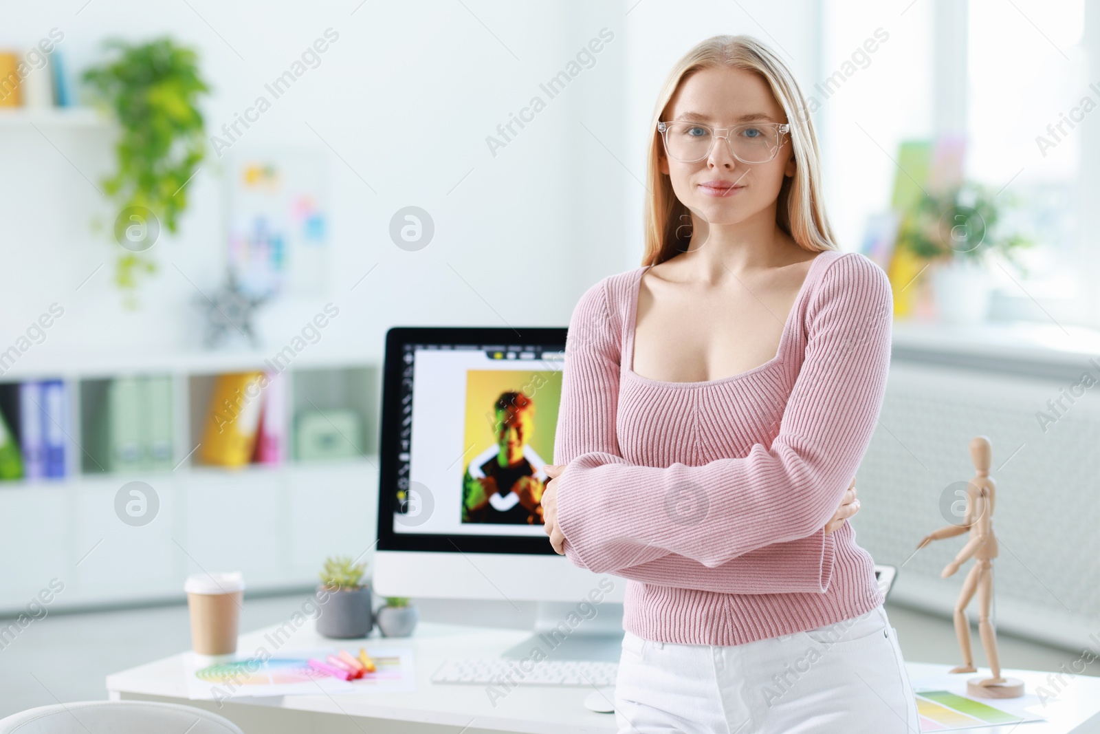 Photo of Portrait of beautiful young designer in office, space for text