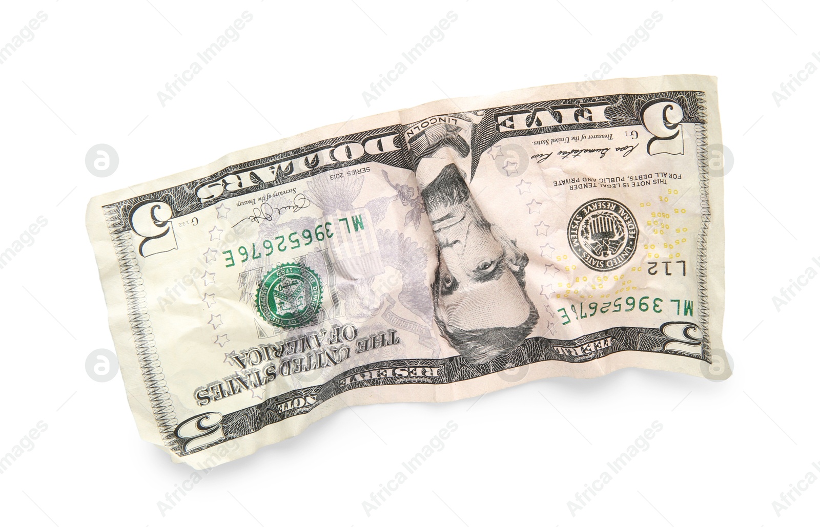 Photo of One crumpled dollar banknote isolated on white, top view