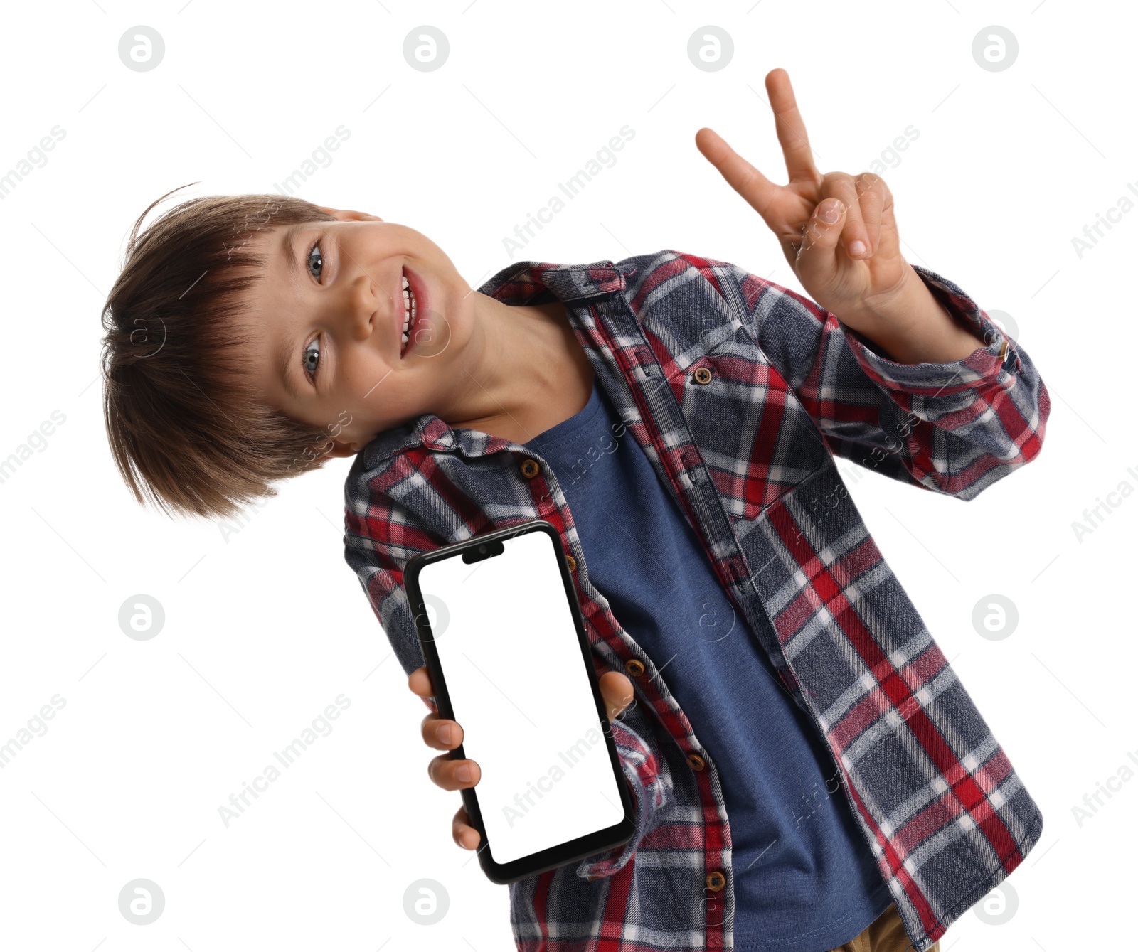 Photo of Cute little boy with smartphone showing peace sign on white background