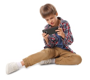 Cute little boy with smartphone on white background