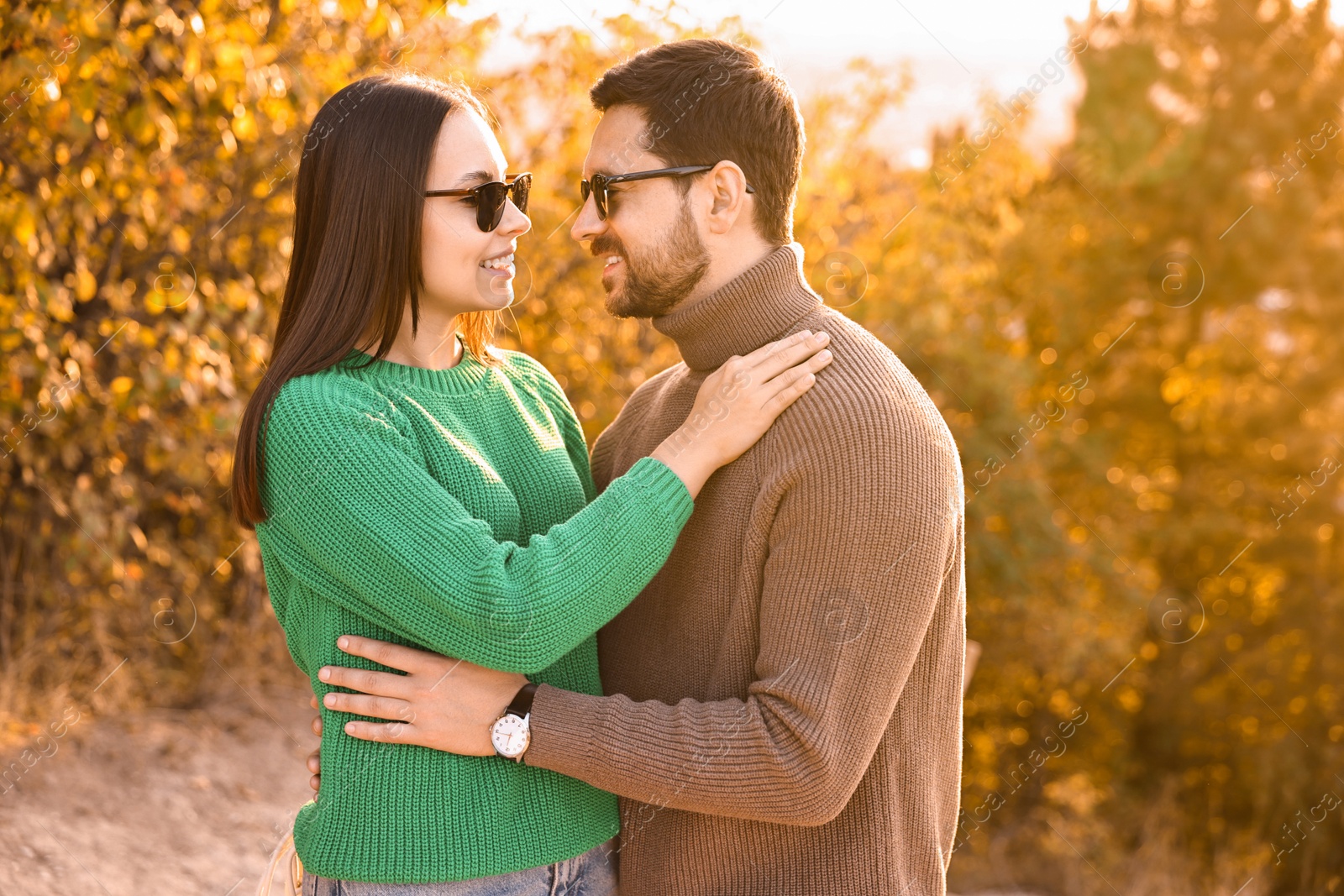 Photo of Beautiful happy couple hugging in autumn park